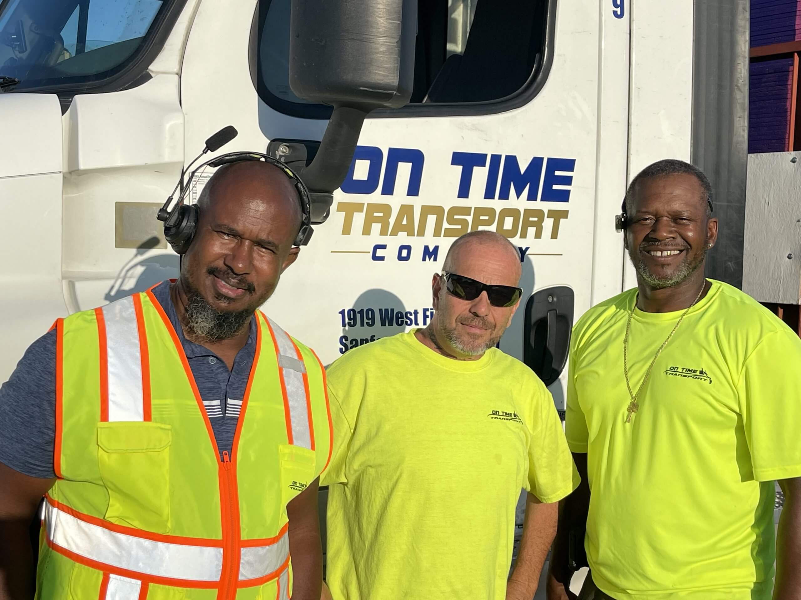 On Time Transport staff wearing yellow shirts